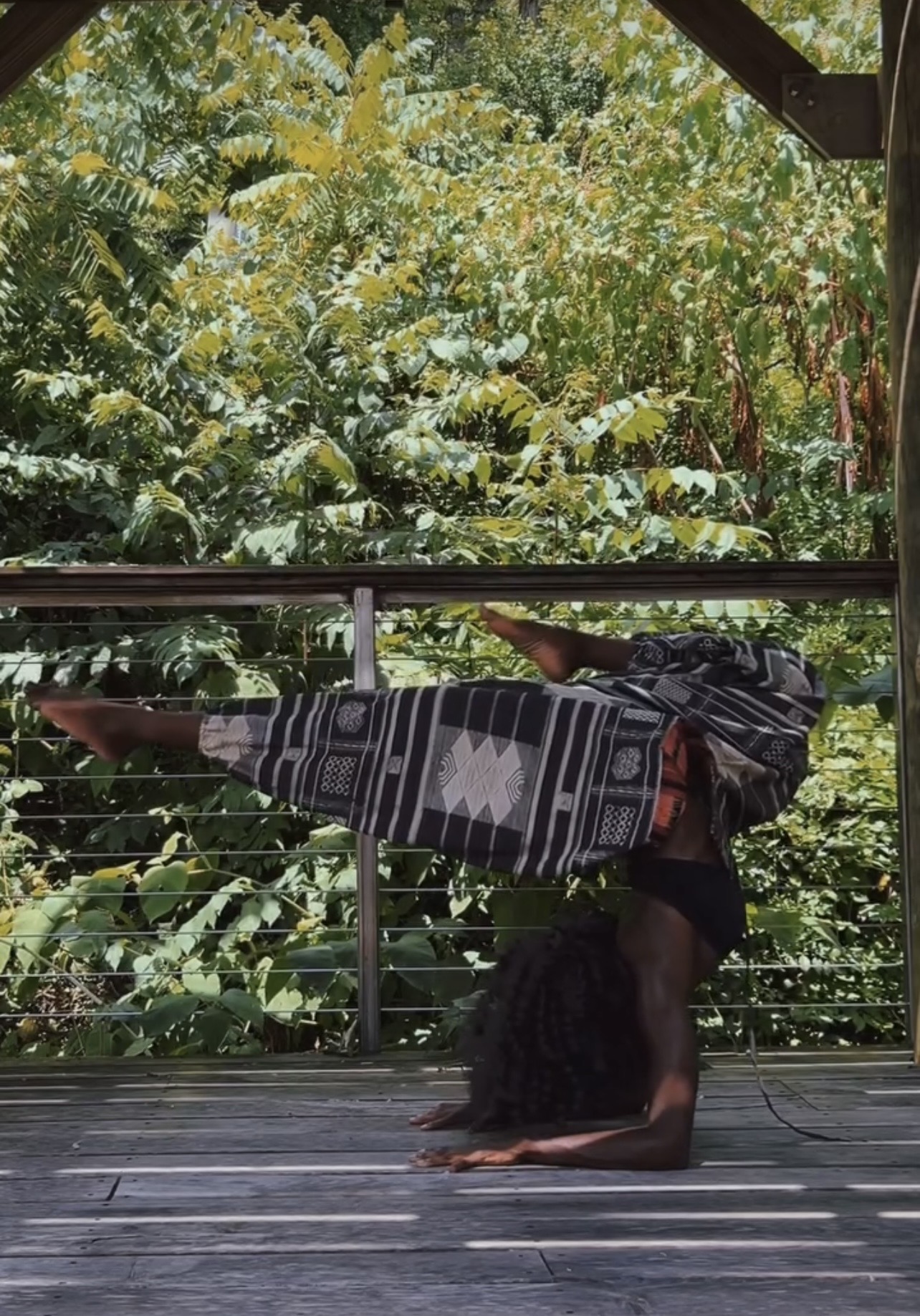 Dalvida in a forearm stand outdoors
